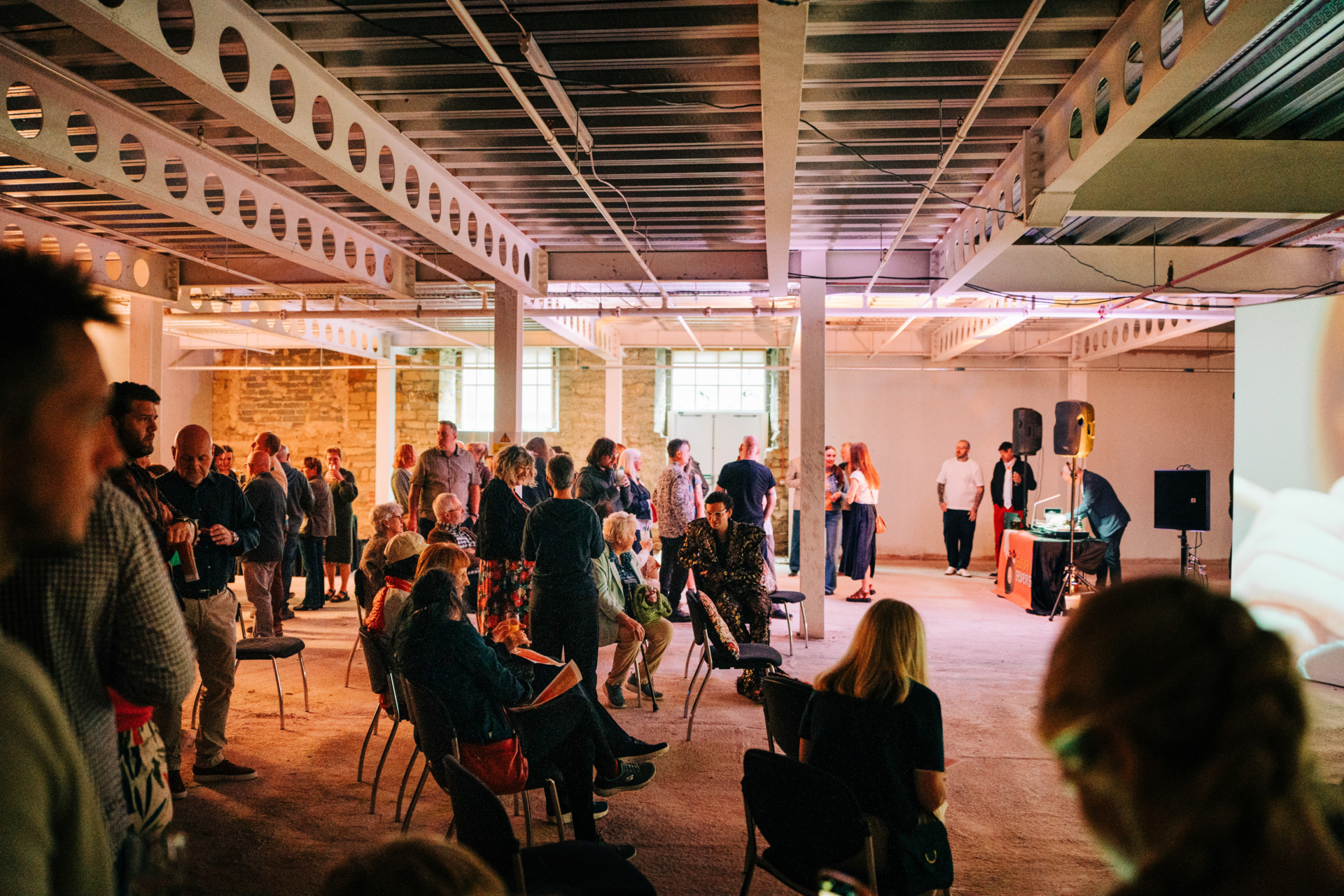 Barnsley Civic - event space filled with people sitting and standing.