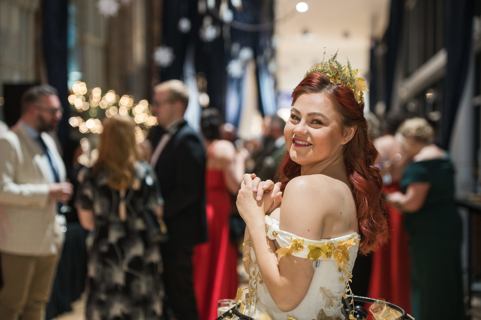 Image of a woman wearing a crown and ball gown, smiling at the camera in Barnsley Civic.